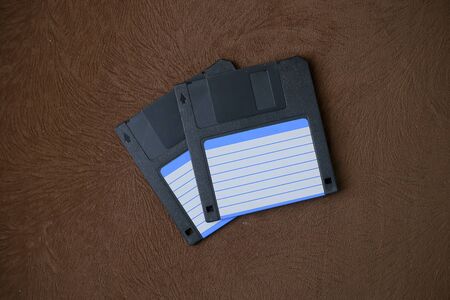 A floppy disk, also known as a floppy, diskette, or simply disk, is a type of disk storage composed of a disk of thin and flexible magnetic storageの写真素材