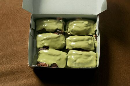 Kue Balok, Little Cubical Brownies or Cake Beams Topped with Melted Matchaの写真素材