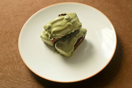 Kue Balok, Little Cubical Brownies or Cake Beams Topped with Melted Matchaの写真素材