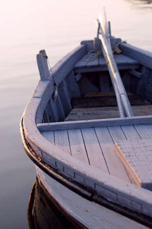 Old wooden boat at sunset.の写真素材