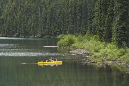five japanese tourists canoeing on a lake - manning provincial park, canadaの写真素材