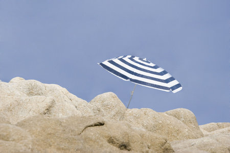 lonely parasol - shelter from the sunの写真素材