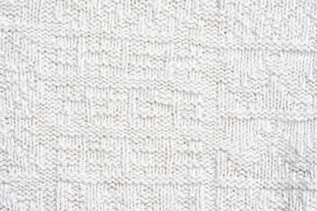 Close-up of a woolen pattern - knitting pattern with purls and knitsの写真素材
