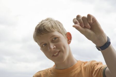 Teenage boy gesturing - Having Funの写真素材