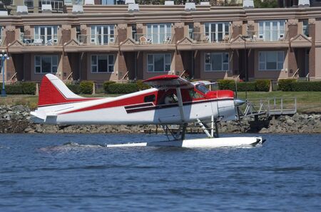 Red and White Seaplane landing - Victoria, Vancouver Island, British Columbia, Canadaの写真素材