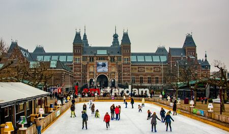 Amsterdam Holland December 2018 winter skating outdoors on the frozen pond in front of the Rijksmuseum including the white drawbridge specialy made for the occasionのeditorial素材