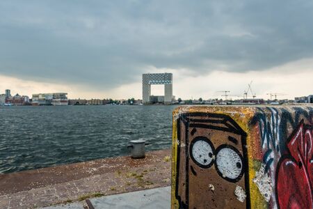 Amsterdam Holland 19 july 2019 skyline of amsterdam seen from amsterdam north over the river ij with a graffity block looking away not over the waterのeditorial素材