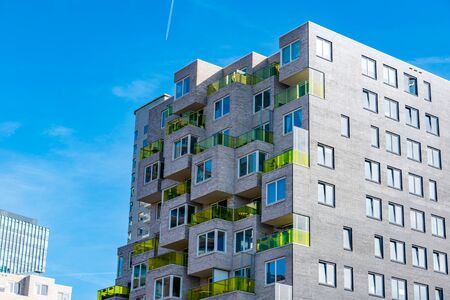Amsterdam 29 September 2019 glass tower buildings in the financial center of the  city of Amsterdam in Holland the Netherlands called the zuid-as with a window cleanerのeditorial素材