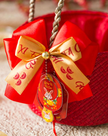 Christmas Decorations in Red Basket on Wooden Background, selective focusの写真素材