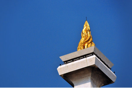 Golden buddha statue on the blue sky background, Thailand.の写真素材