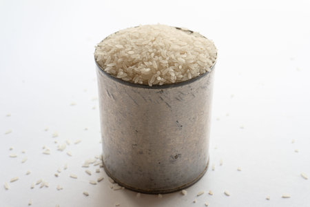 Indonesian Kalimantan native raw rice in a can isolated on a white background.の写真素材