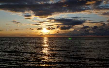 Sunset on the Baltic coast, the cold sunの写真素材
