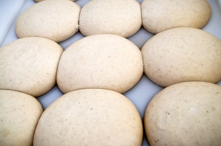 Pizza loaf from bakery, ready to become pizza italian foodの写真素材