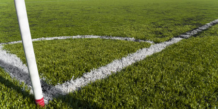 Corner kick in a plastic grass soccer fieldの写真素材