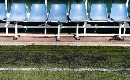 Coach and reserve benches in a soccer fieldの写真素材