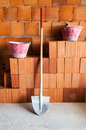 masonry, Bricks, Shovel and buckets in a under construction site の写真素材