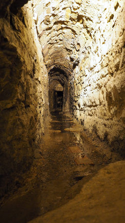 Old historical underground stream sewer in medieval environment