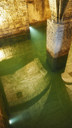 Old historical underground water well in medieval environmentの写真素材