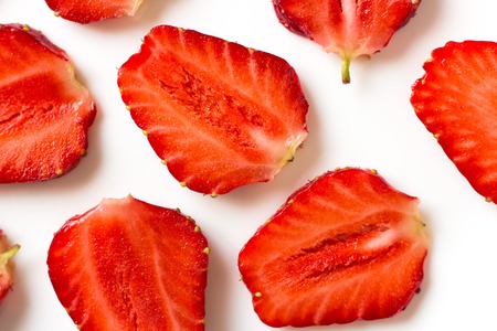 Sliced straberries on whiteの写真素材