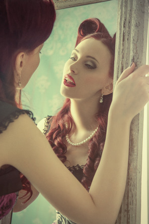 Pin-up girl in vintage room. American styleの写真素材