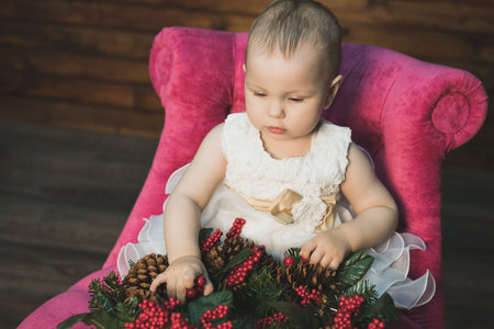 Pretty little girl meets Christmas at home