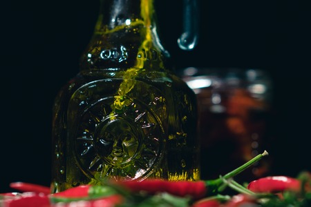 olive oil, baked tomatoes and chilli on black backgroundの写真素材