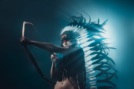 Native American woman isolated on blue wall
