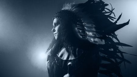 Native American woman isolated on blue wall
