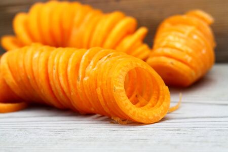 Spiralized carrot on a wooden backgroundの写真素材