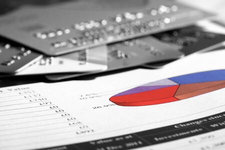 Credit cards on a financial report documentの写真素材
