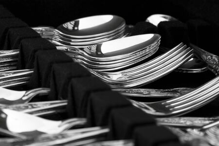 A canteen of antique silver cutlery on displayの写真素材
