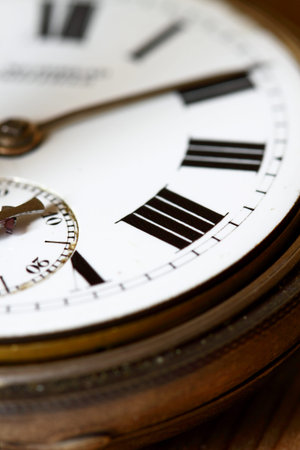 Close-up of the face of an antique pocket fob watch