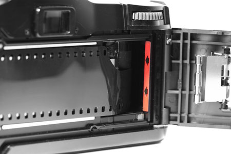Vintage retro camera with a strip of film loaded