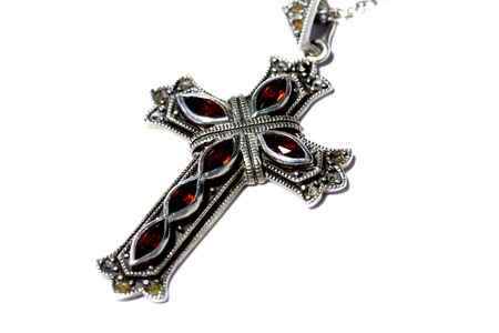 Crucifix cross necklace isolated on white backgroundの写真素材