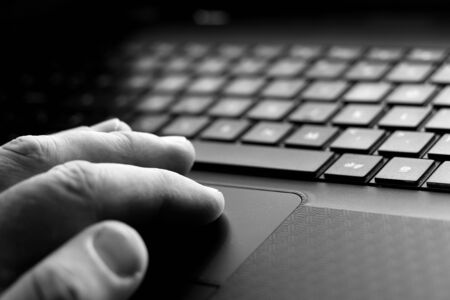 Man using a laptop computerの写真素材