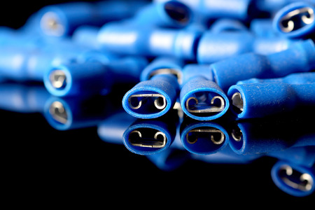 Blue crimps reflected on a black backgroundの写真素材