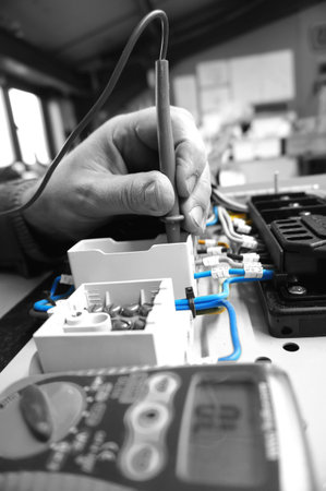 Man  testing wiring with a multimeter