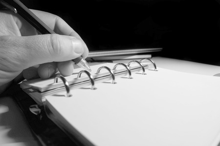 Man writing in a Filofax.の写真素材