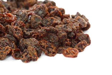 Pile of raisins isolated on white backgroundの写真素材