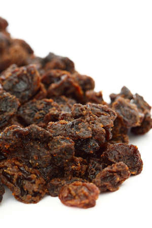 Pile of raisins isolated on white backgroundの写真素材