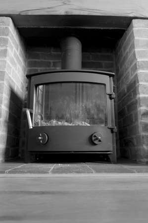 Brick fireplace with log burner.の写真素材