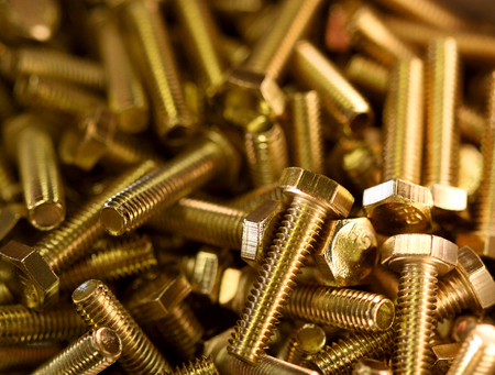 Pile of hex brass boltsの写真素材