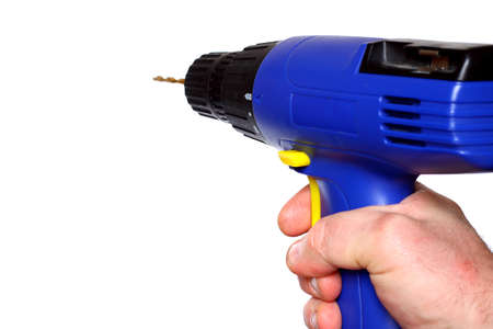 Man holding cordless drill isolatedの写真素材