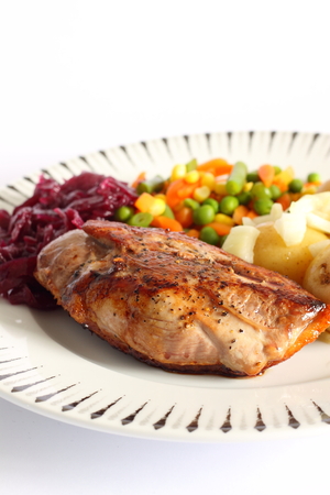Duck breast meal on a plate with vegetablesの写真素材
