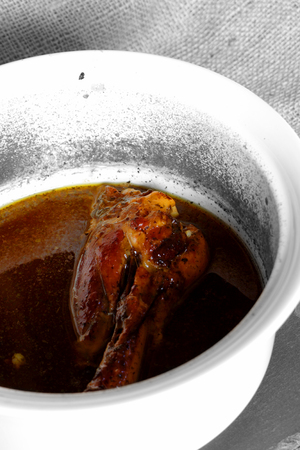 Abstract image of lamb shank cooked with a mint gravy in a pot.の写真素材