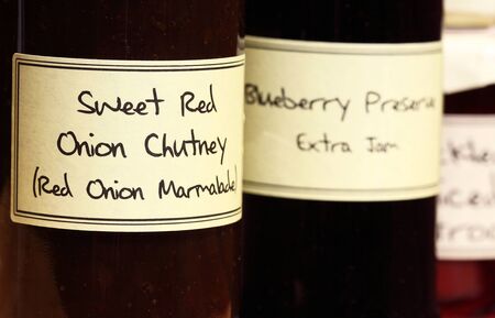 Homemade sweet red onion chutney in a glass jarの写真素材