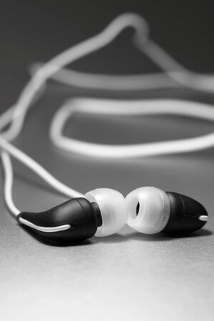 Earphones on a silver backgroundの写真素材