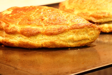 Freshly baked Cornish pasties on a baking tray
