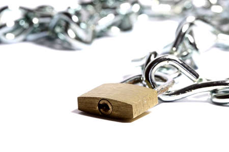 Padlock and chain isolated on a white backgroundの写真素材