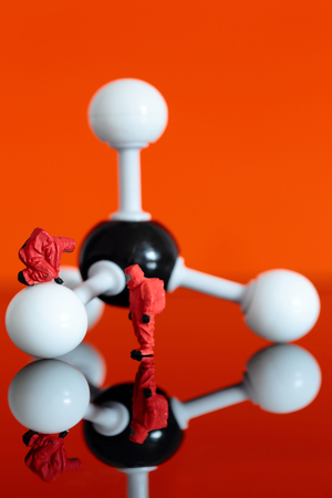 Miniature model chemical team with a molecular model of methaneの写真素材